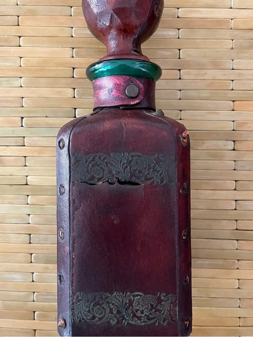 Handcrafted Red Leather Decorative Bottle with Green Glass Accent